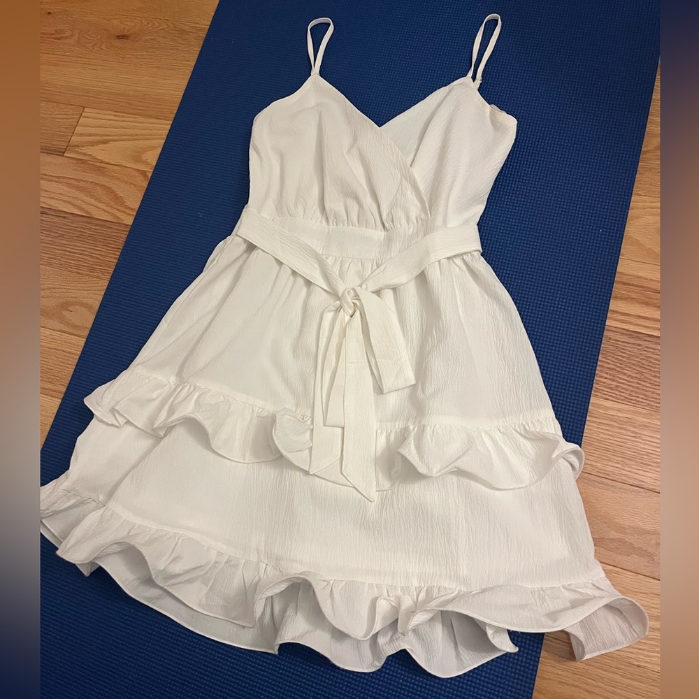 These three boutique white ruffle dress